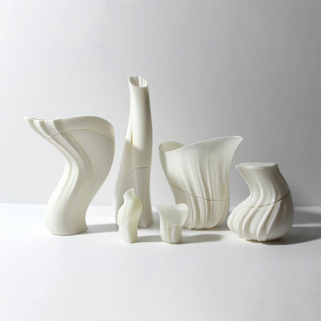 3D printed miniature prototypes of urn designs.